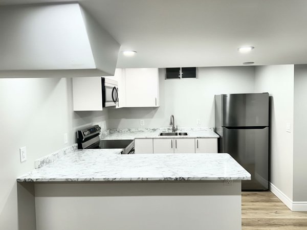 Compact kitchen renovation with marble countertops, Toronto GTA